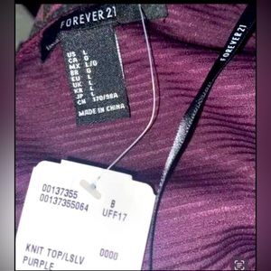 Long Sleeve Plum Knit Top. Lines thru the shirt in the pattern. It’s classy .